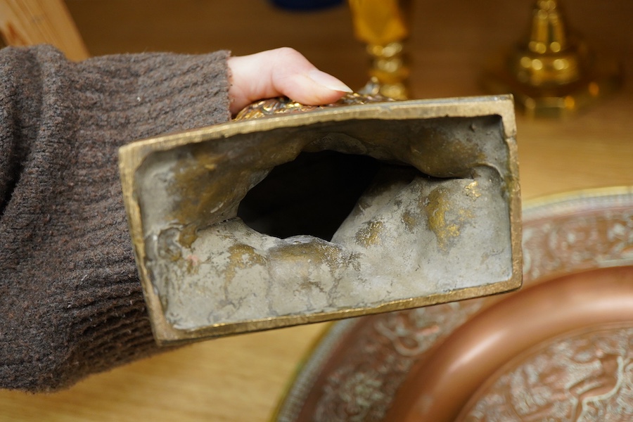 A group of copper and brassware to include candlesticks and an alms dish, 45cm in diameter